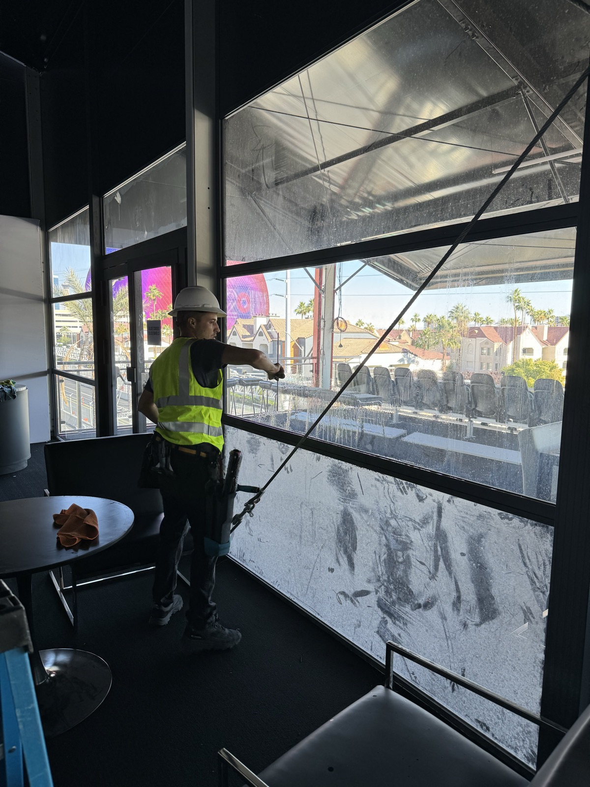 Stucco splatter and construction debris on a new Las Vegas window before cleaning